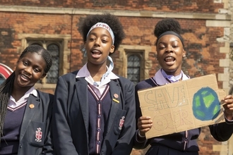 Young people with placard by Penny Dixie