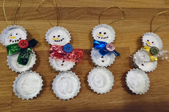 Recycled bottle tops made into snowmen decorations