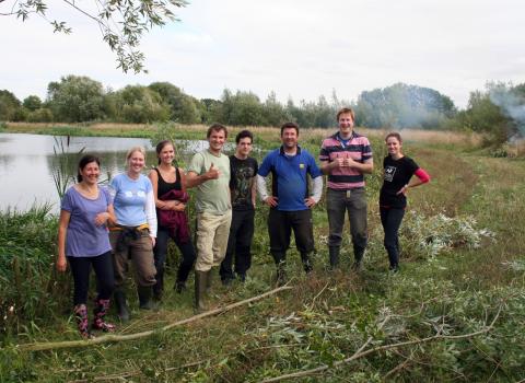 Happy volunteers from BGL Group help to remove willow from Irthlingborough in Sept 2013