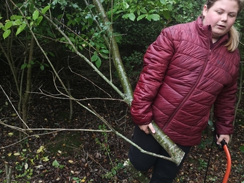 Youth ranger doing reserve conservation activities outdoors