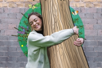 A woman hugging an illustrated tree
