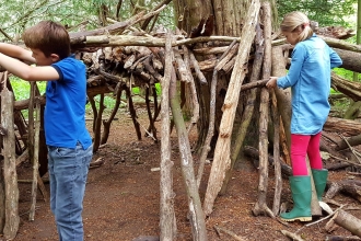 Boy and girl den building