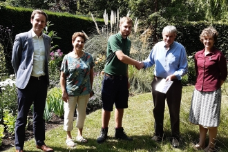 Wildlife Gardening Judge Bernard Hunt and Sue Barnard from the Wildlife Trust BCN awarding first prize to Downing College