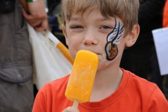 Child eating lolly at Cambourne to be Wild 2019 