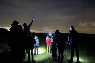 A Wildlife Watch group stargazing 