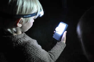 Child with bat detector