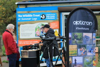 Opticron stand with binoculars outside Summer Leys centre