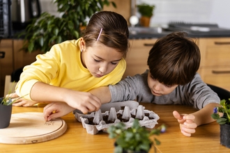 Children planting seeds 