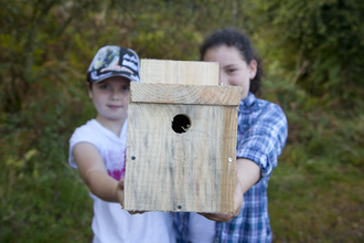 Children holding bird box by Peter Cairns/2020VISION