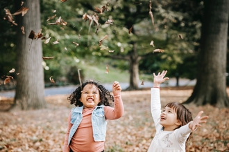From pexels.com children playing with leaves