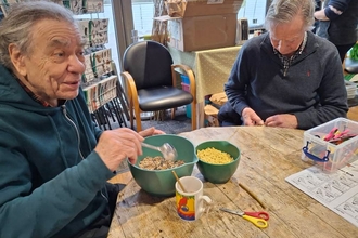 People making bird feeders