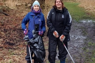 Interns at Rothschild bungalow with litter picking equipment 