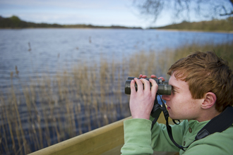 child with binoculars David Tipling/2020VISION 