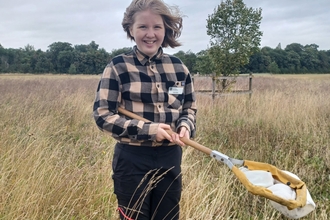 Work experience Emily with sweep net at Trumpington Meadows