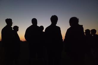 silhouettes at sunset by Rebecca Neal