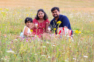 Family picnic in the meadow by Jon Hawkins- Surrey Hills Photography