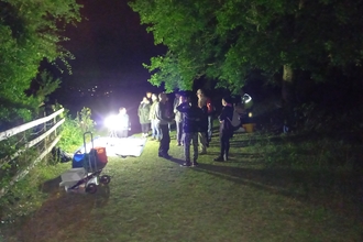People at night on hill