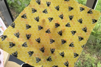 Arm holding beeswax wrap
