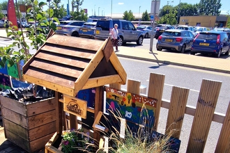 Wishing well planter in the community garden