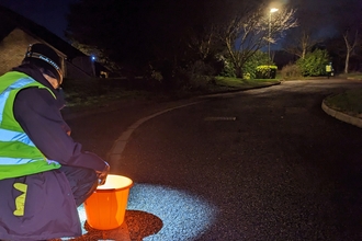 Toad patrol volunteer at Papworth Everard by Rebecca Neal