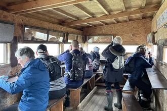 Group of people in bird hide