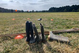 wellies waiting to be thrown at Trumpington Meadows by Rebecca Neal