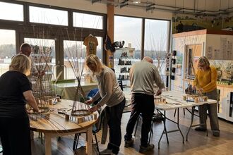 group of people willow weaving