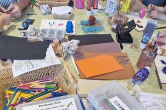 table photo filled with craft materials