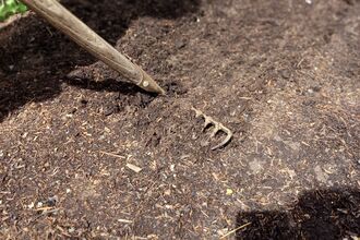 raking at Cambourne Church Community Garden by Rebecca Neal