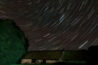 Photos shows image of star trails over Ramsey heights classrooms