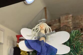 A Christmas tree angel made from a wooden peg