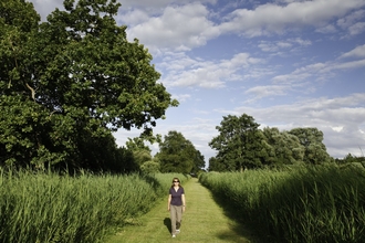 A person walking at Woodwalton Fen