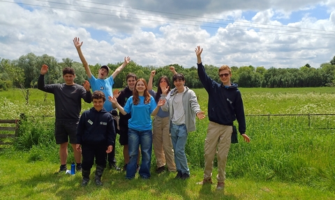 Young People's Forum members standing in the garden at Strawberry Hill