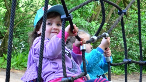 Children climbing the spider's web netting at the Nene Wetlands