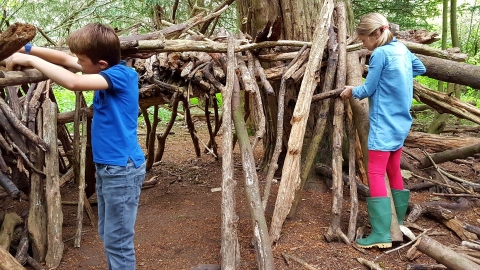 Boy and girl den building