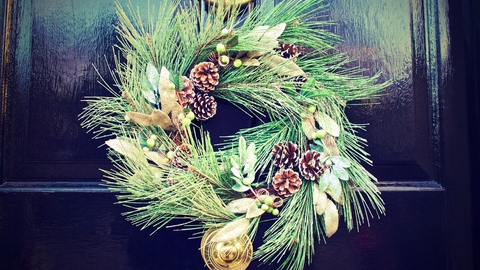 Green and White Wreath on Black Door
