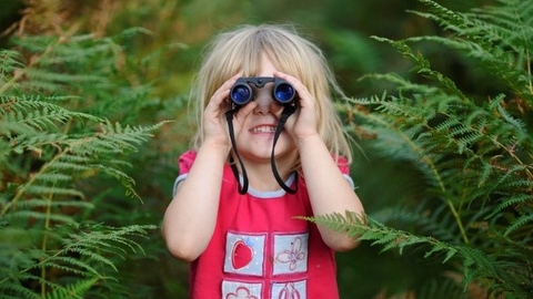 Child with binoculars