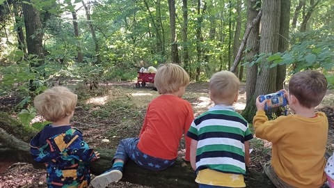children on log in Cambourne Nature Reserve by Rebecca Neal