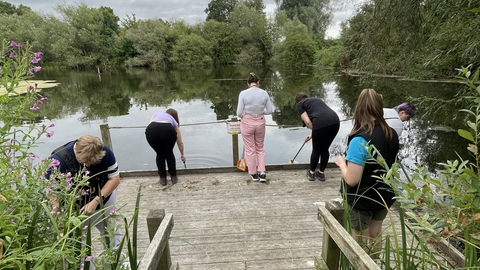 Group of women pond dipping