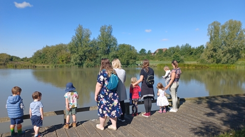 Little Bugs children and parents by the fishing lake in Cambourne by Rebecca Neal