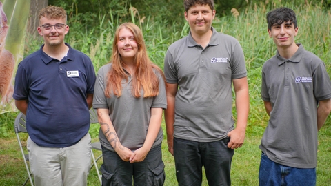 Three young men and a young woman in Wildlife Trust tshirts