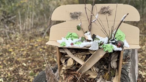 Cardboard box crafted to look like an underground hibernation sett for a badger