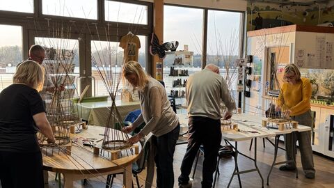 group of people willow weaving