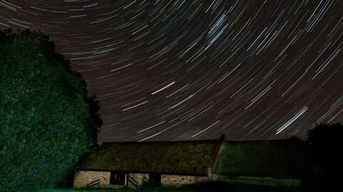 Photos shows image of star trails over Ramsey heights classrooms