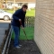 Fiona Mansfield raking in the garden