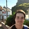 A member of the YPF smiling towards the camera on a sunny day