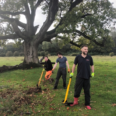 3 people doing practical conservation outdoors