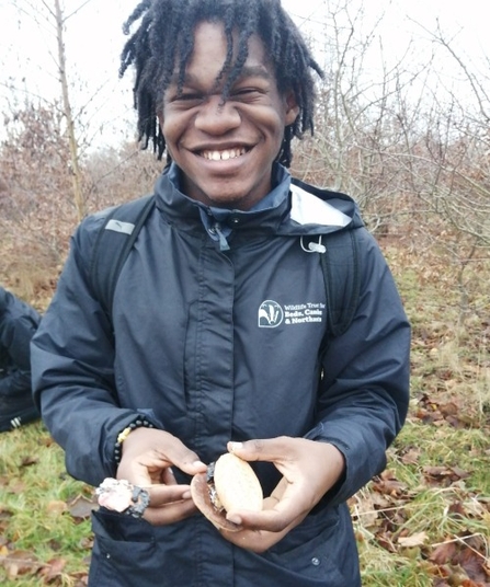 A member of the YPF smiling towards the camera