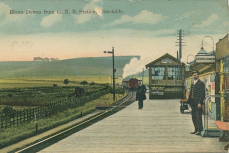 Postcard of GNR Station, Dunstable. Blow's Downs is in the background.
