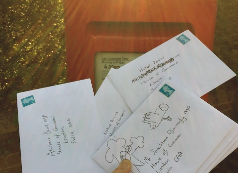 Letters from children being posted